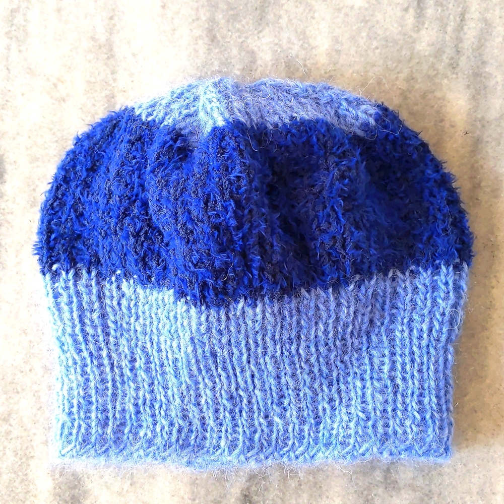NWOT. Handmade kid's hat with two colors.